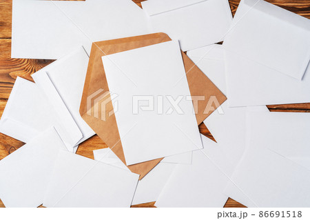 stacked envelopes on a desk