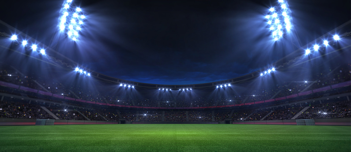 soccer stadium under floodlights