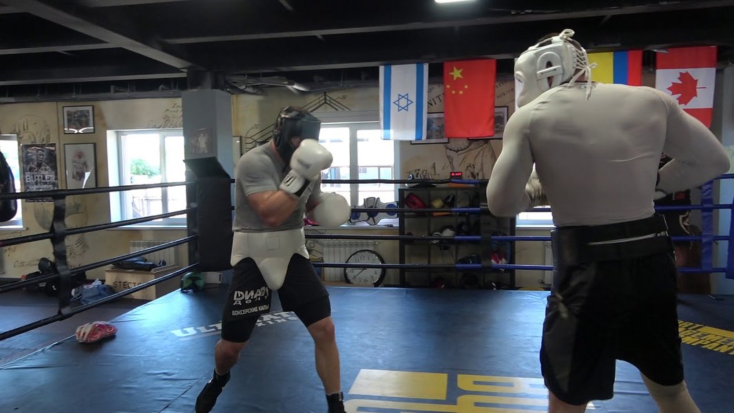 Boxers sparring, showcasing disciplined technique