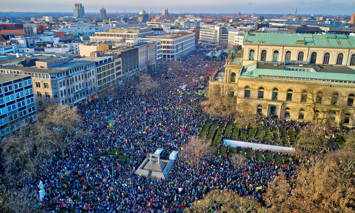 scenic photograph of parliament building and public rally