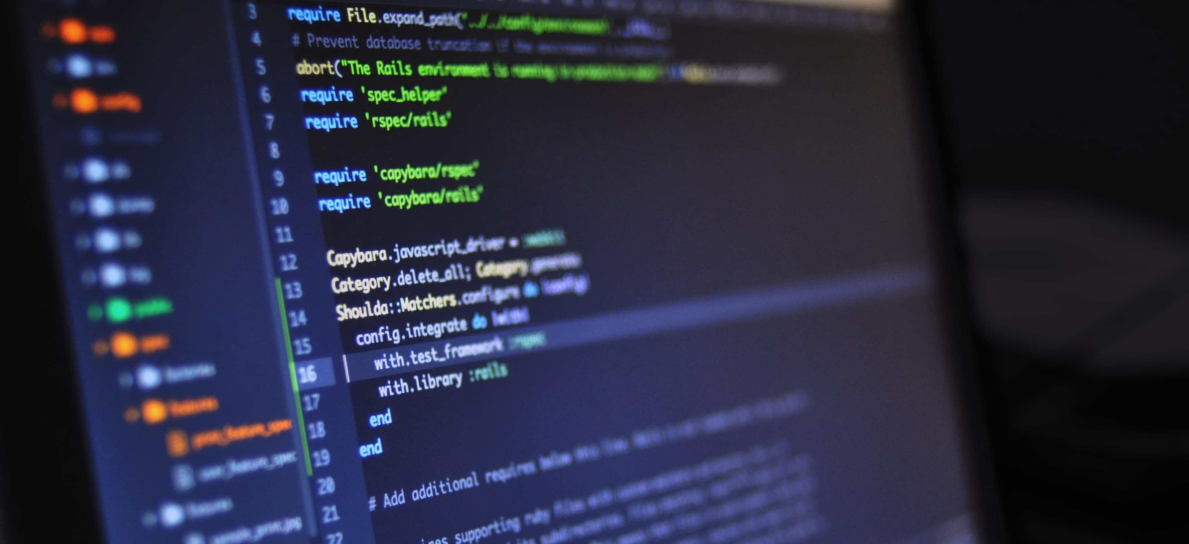 java code on computer screen with spring framework logo