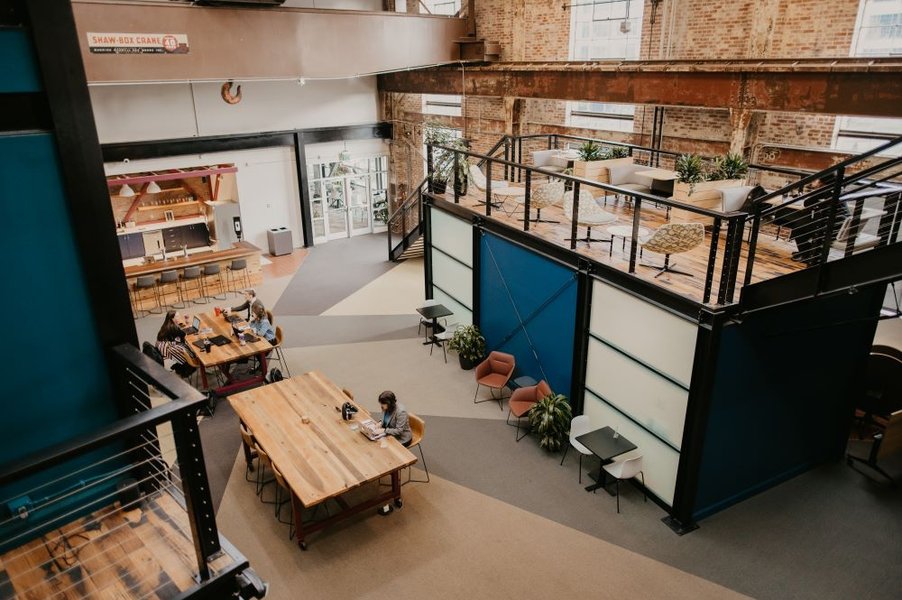 Aerial view of a modern coworking space with people collaborating