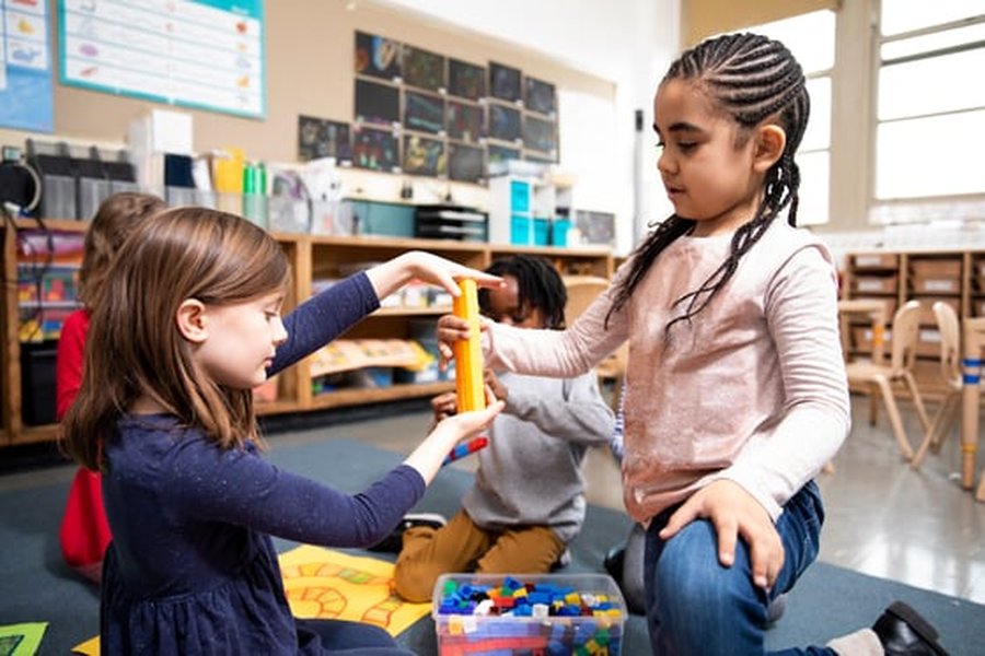 Students engaged in hands-on STEM learning with manipulatives