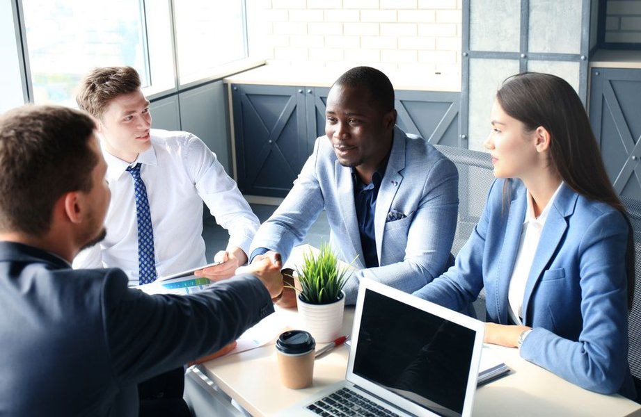 Collaborative team of consultants working on a project