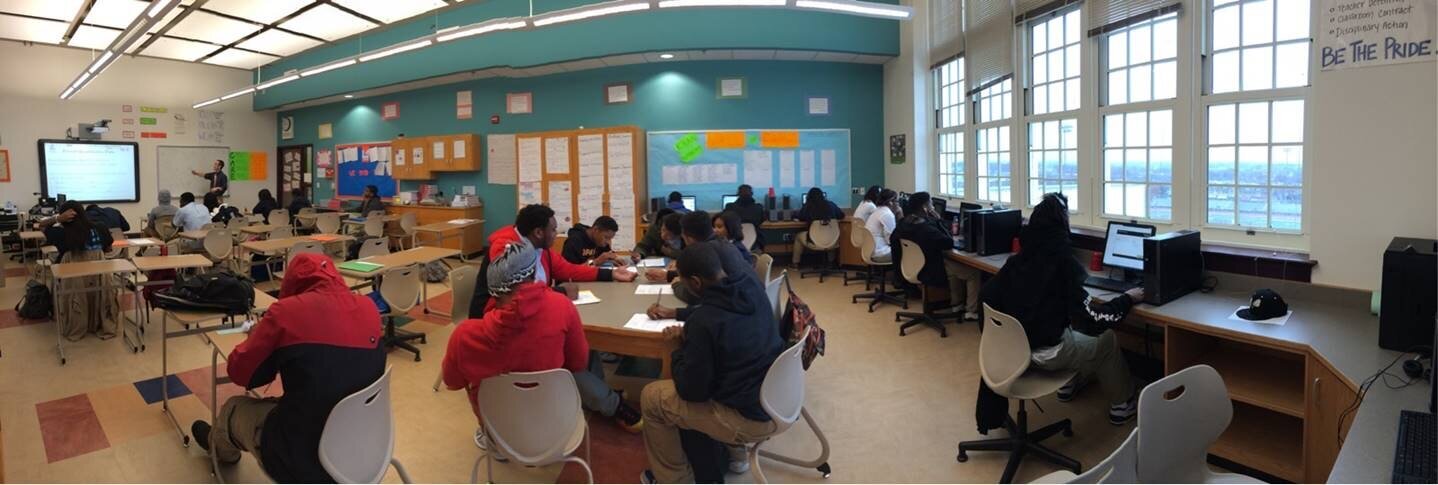 students studying in a classroom with organized desks