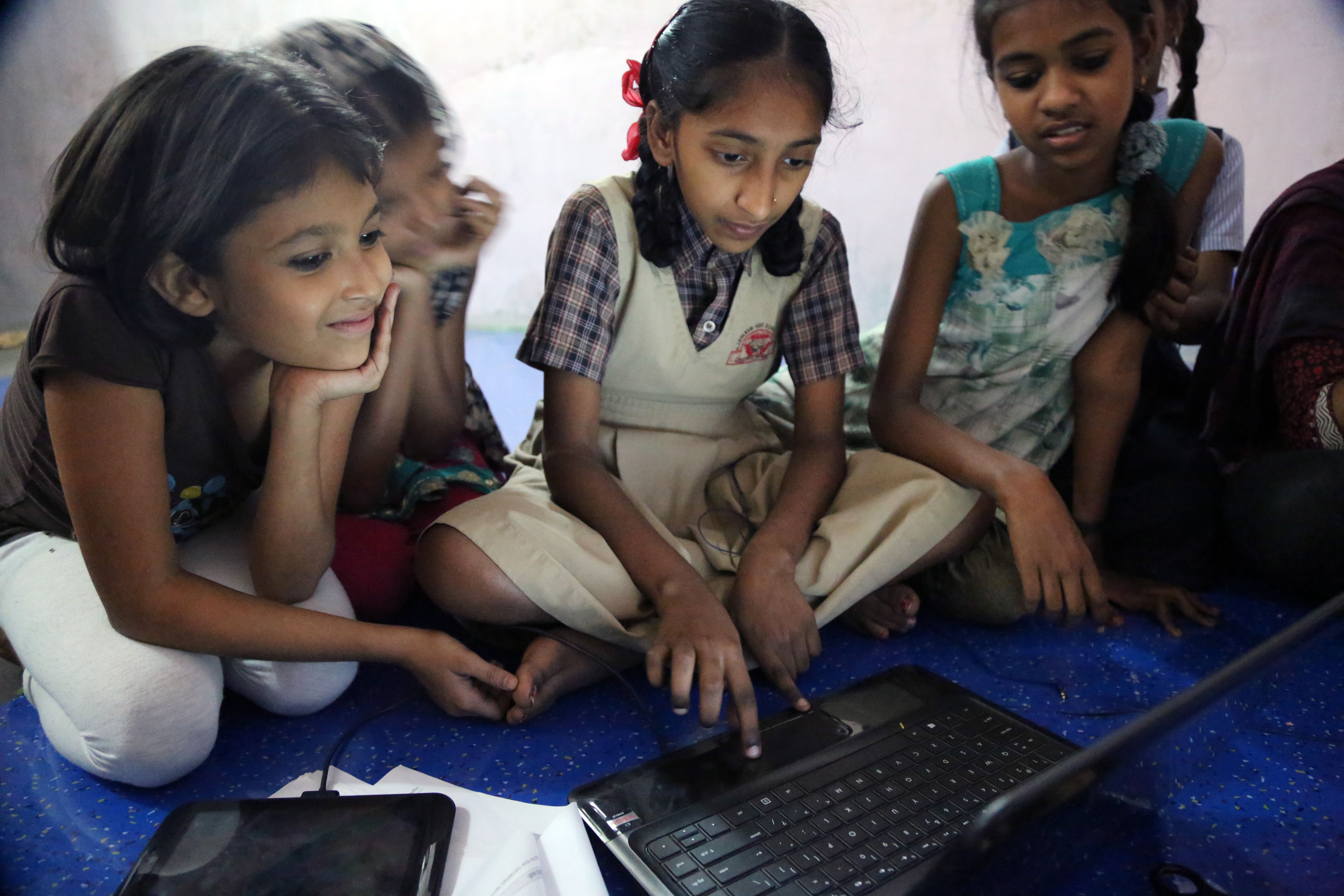 students using apps on laptops and phones