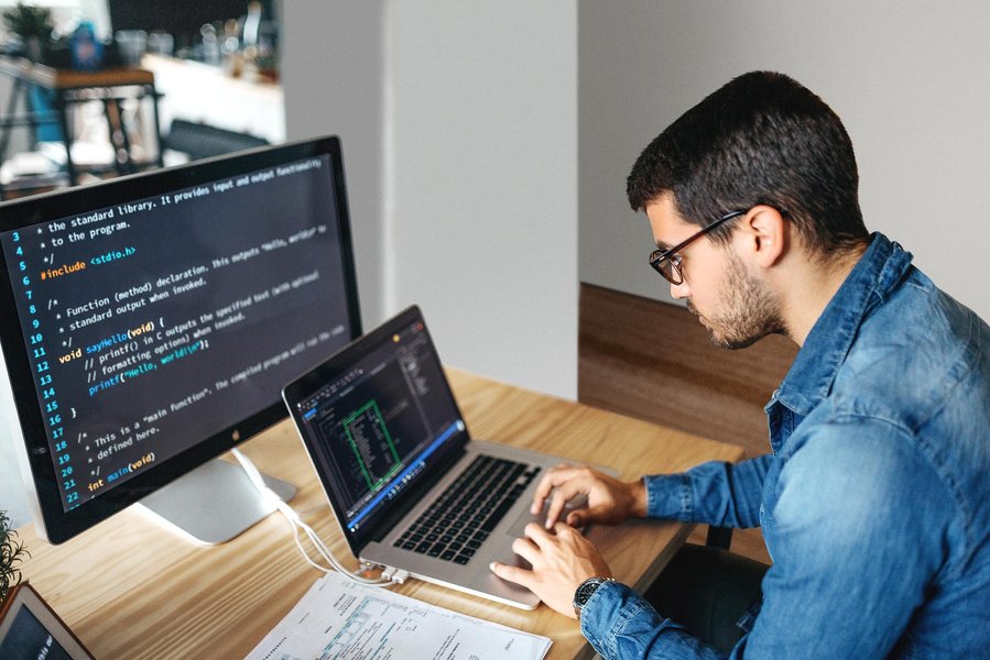 Python code displayed on a laptop screen