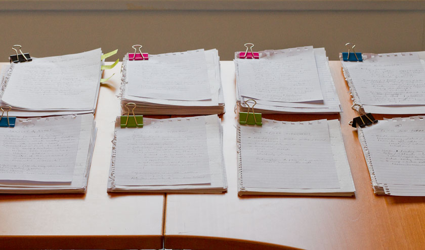 books, texts, writing desk with paper
