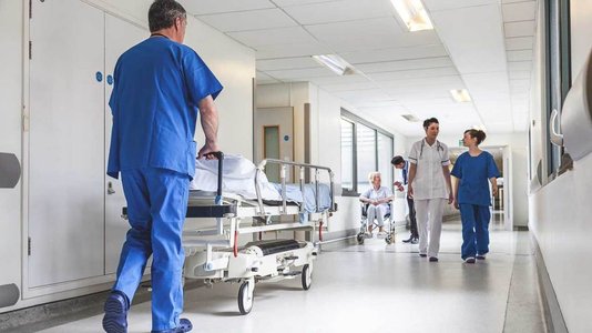 nurse working in hospital hallway