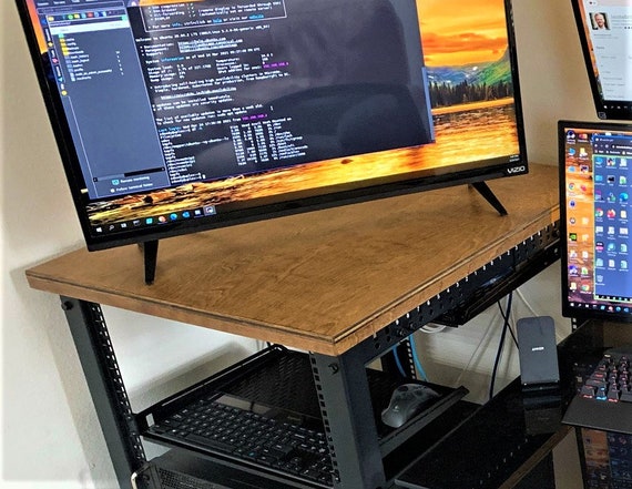 modern computer workspace with code and server racks