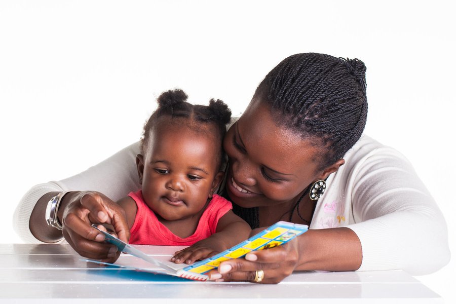 Parent reading to a baby