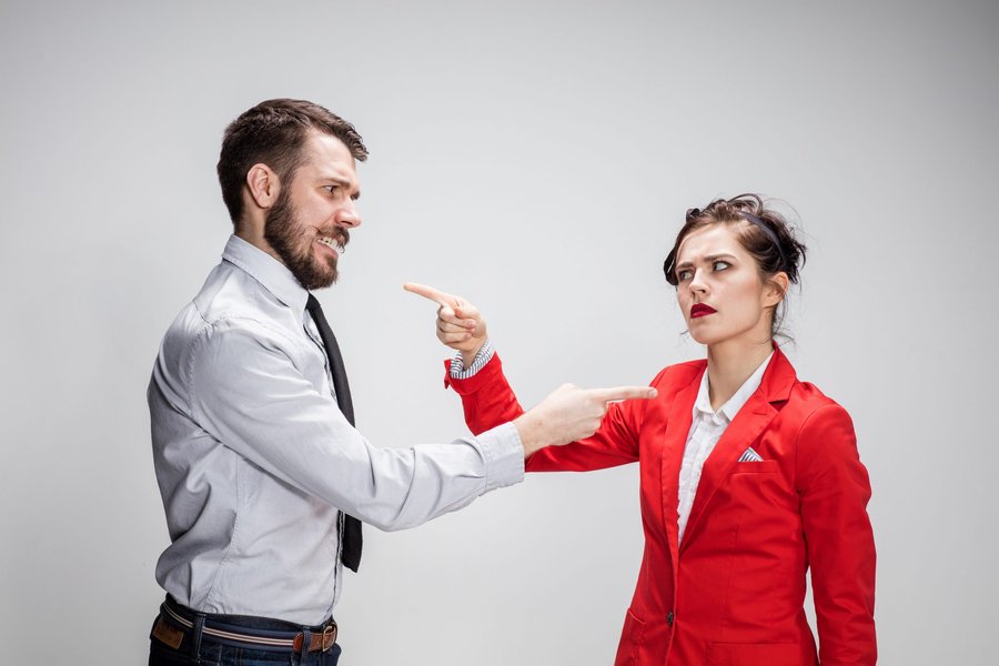 Two people engaged in a serious but calm discussion across a table