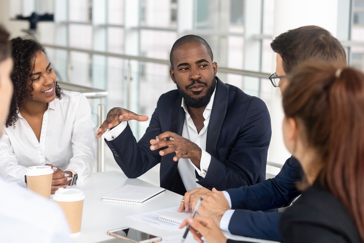 people communicating in meeting