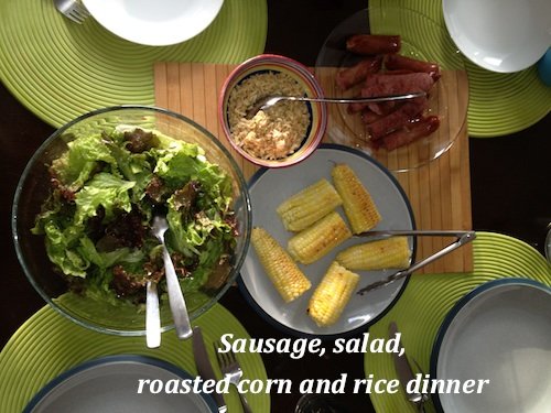 toddler eating mixed meal with meat and vegetables
