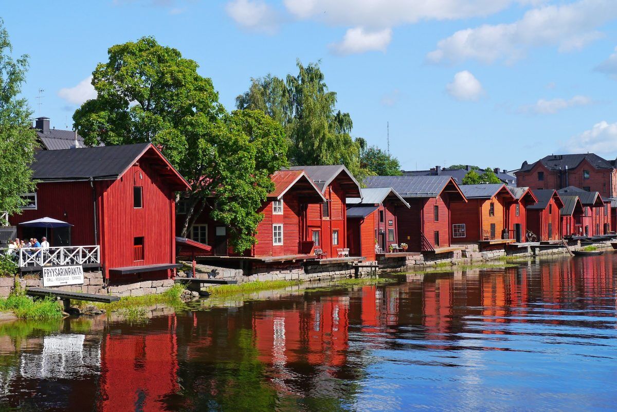 Finnish countryside with lakes and traditional buildings