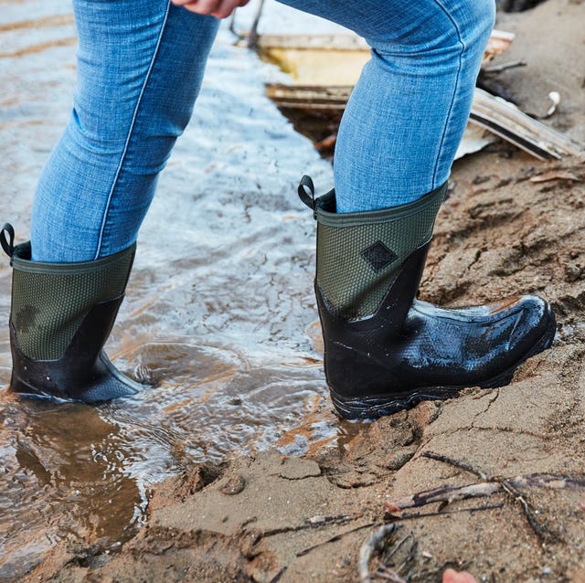 rainy farmland, muddy field, vintage boots