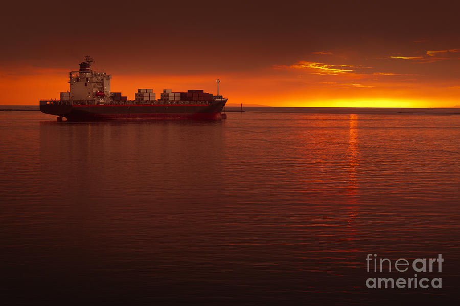 cargo ships at sunset
