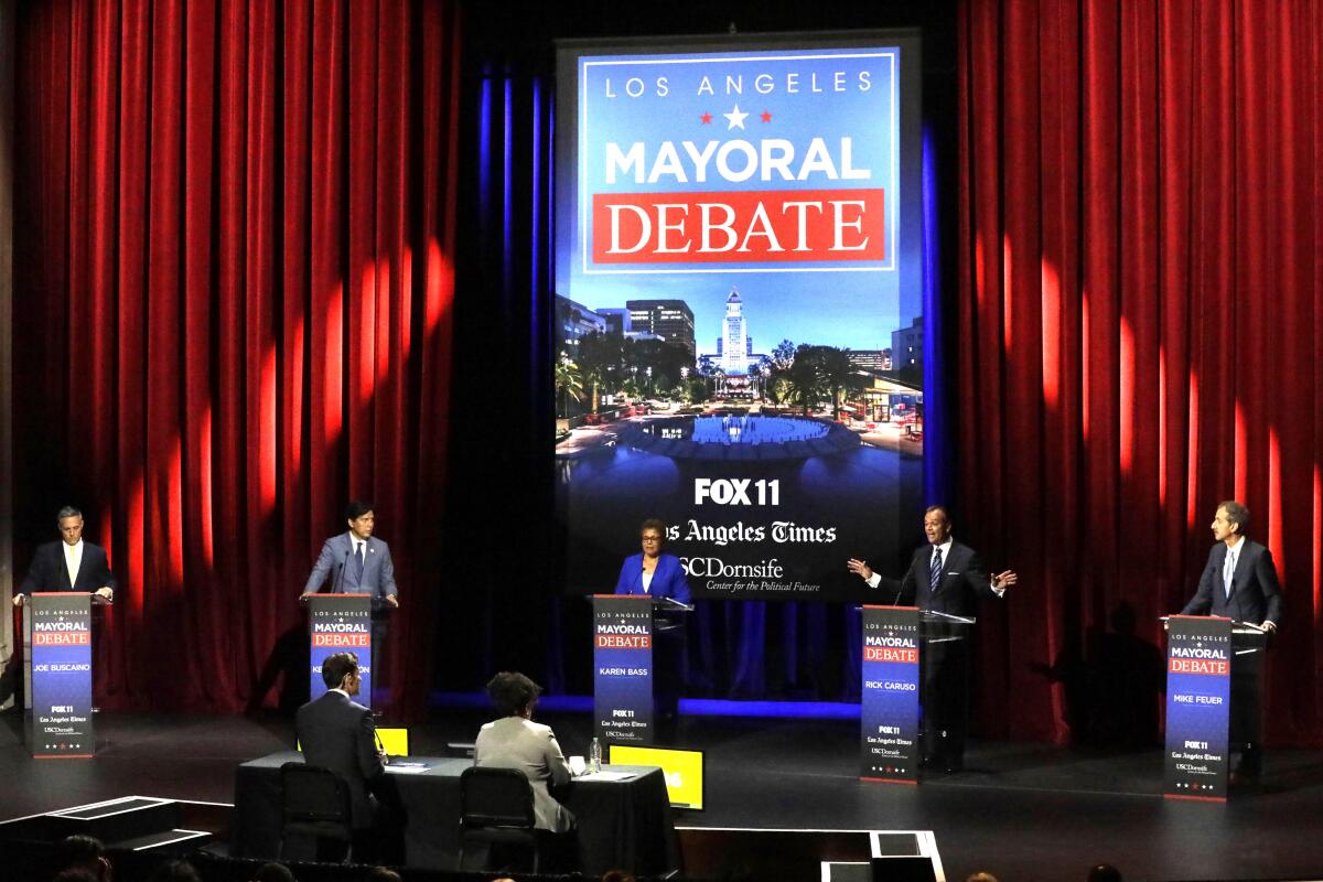 political debate stage with protestors
