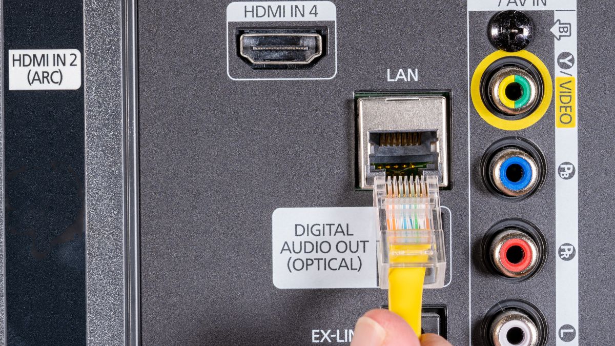 modern television setup with LAN cables and smart devices