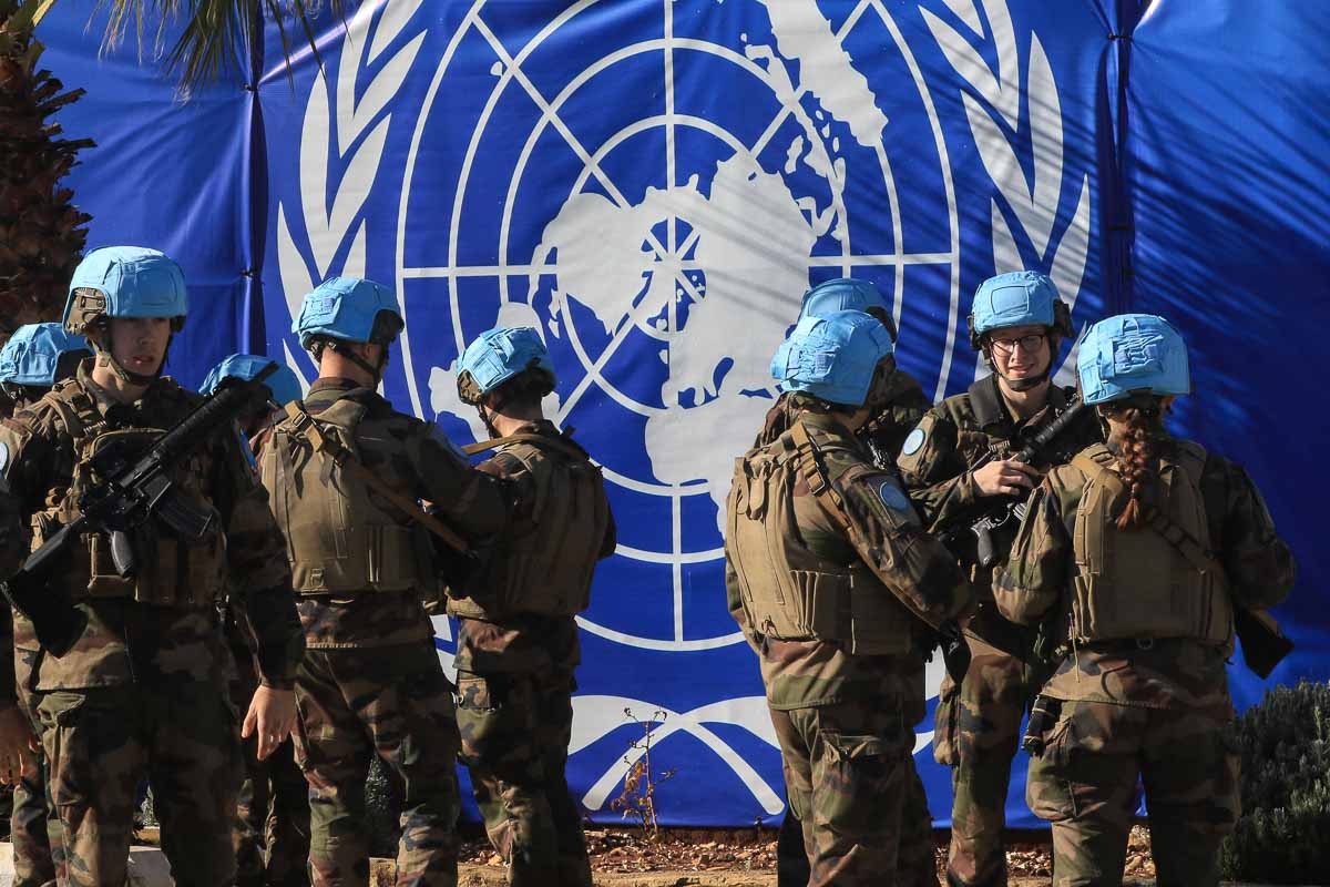 UN building, international conference, military conflict