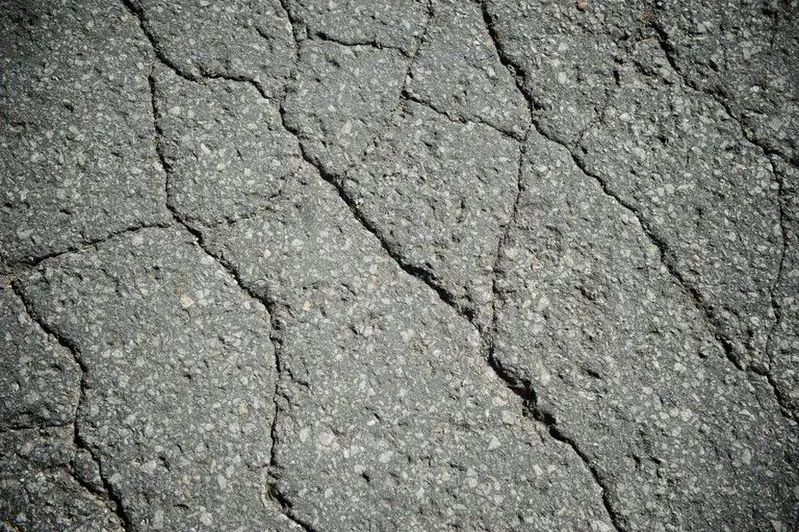 Alligator cracking pattern on asphalt pavement