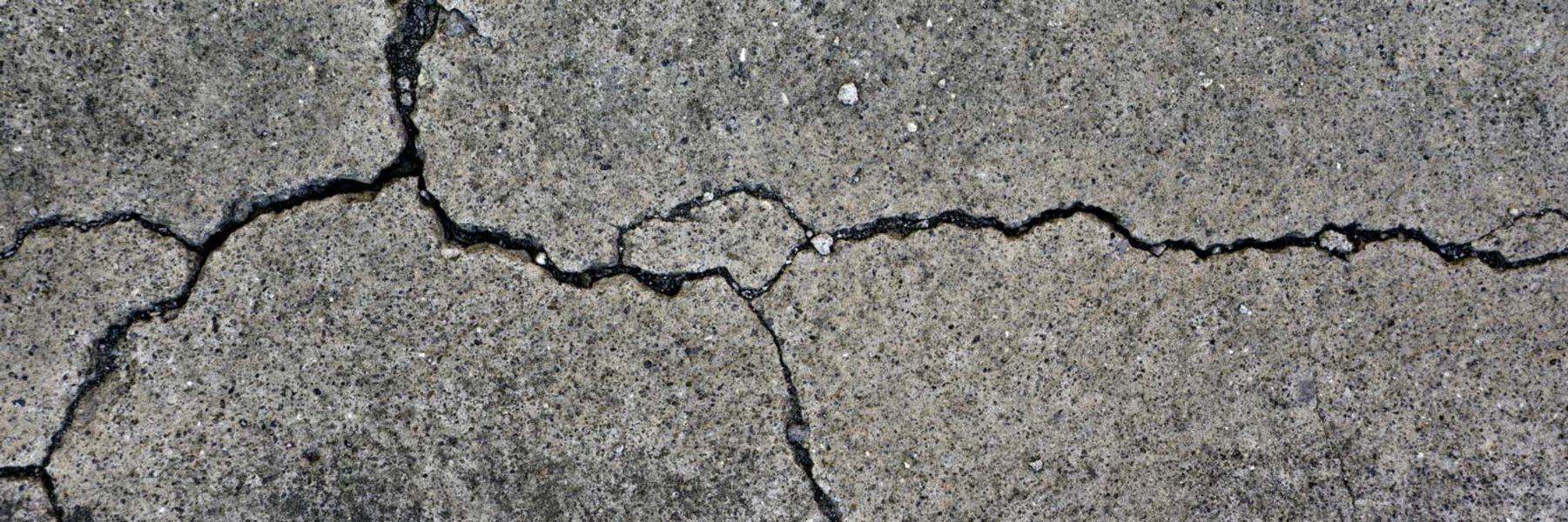 Cracked concrete driveway surface