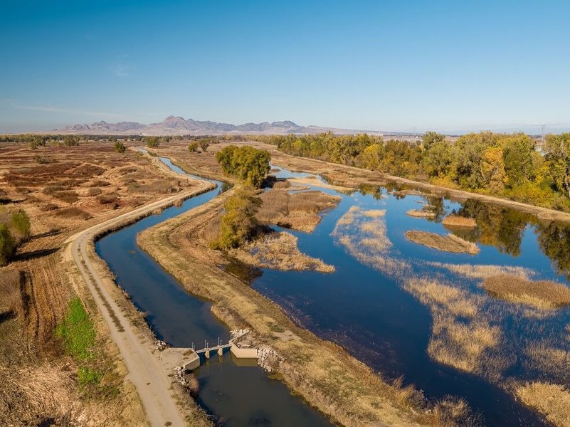 Aerial view of a floodplain bypass channel alongside a river