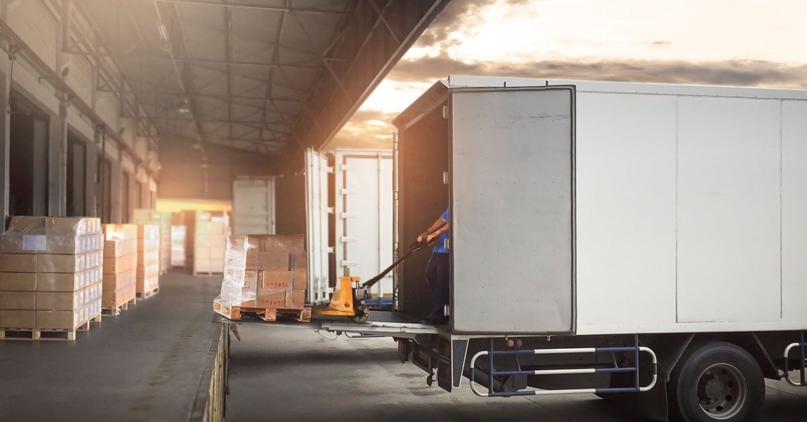 Workers loading freight into a truck