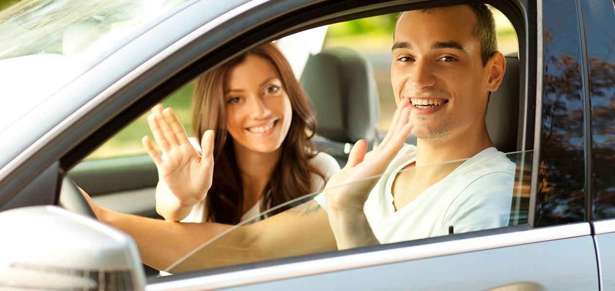 Person smiling and waving