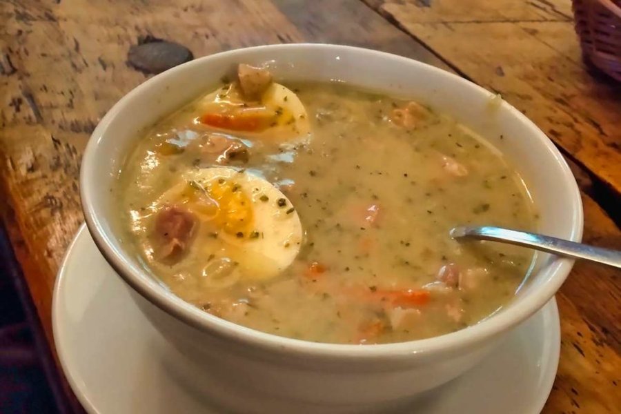 Bowl of traditional Żurek Śląski soup