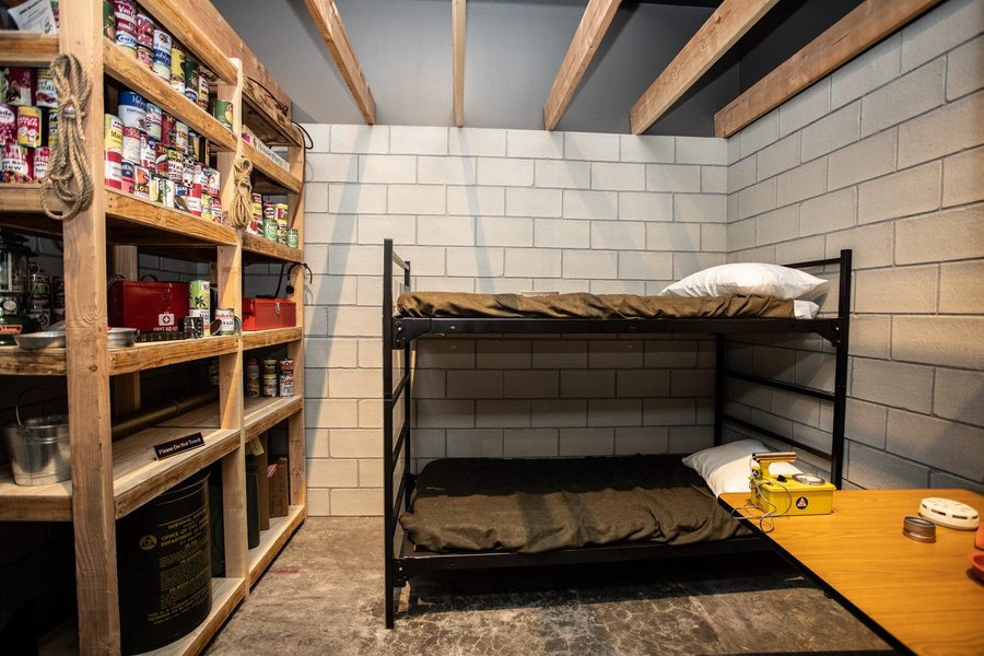 Interior of a fallout shelter, indicative of Cold War era civil defense preparations often found in public buildings like libraries.