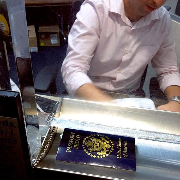 People waiting in line at a passport office.