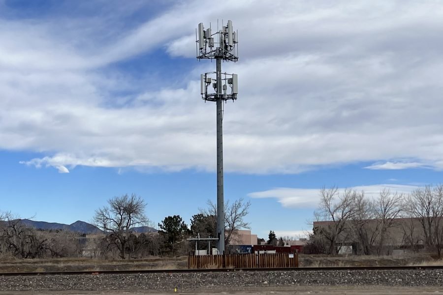Cell towers against a sky background
