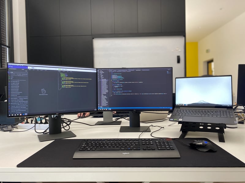 coding workspace, modern computer screens, collaborative programming