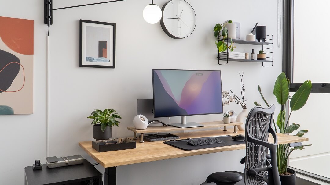 modern office workspace with computer screens and research tools