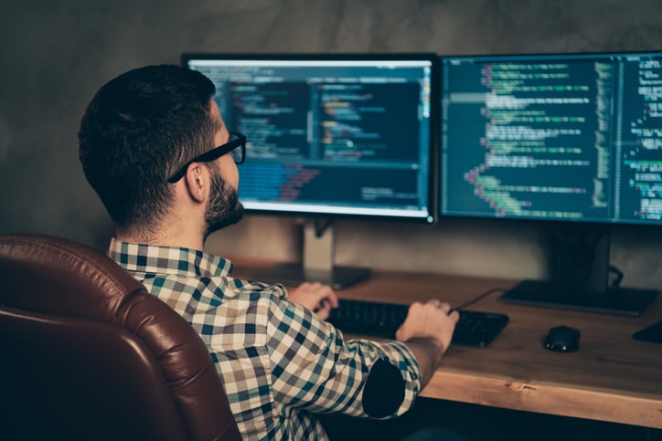 programmer working on modern desktop interface