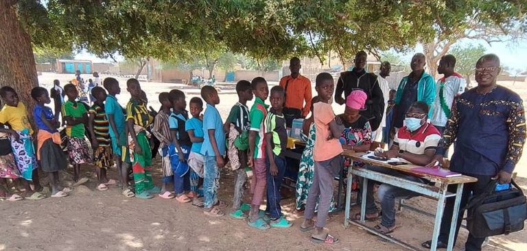 rural community meeting outdoor vaccination campaign