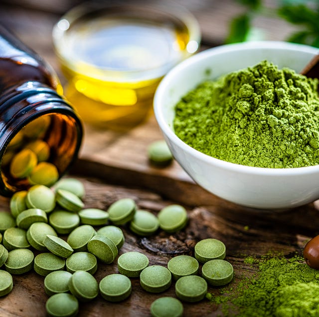 fresh vegetables and moringa leaves on a rustic table