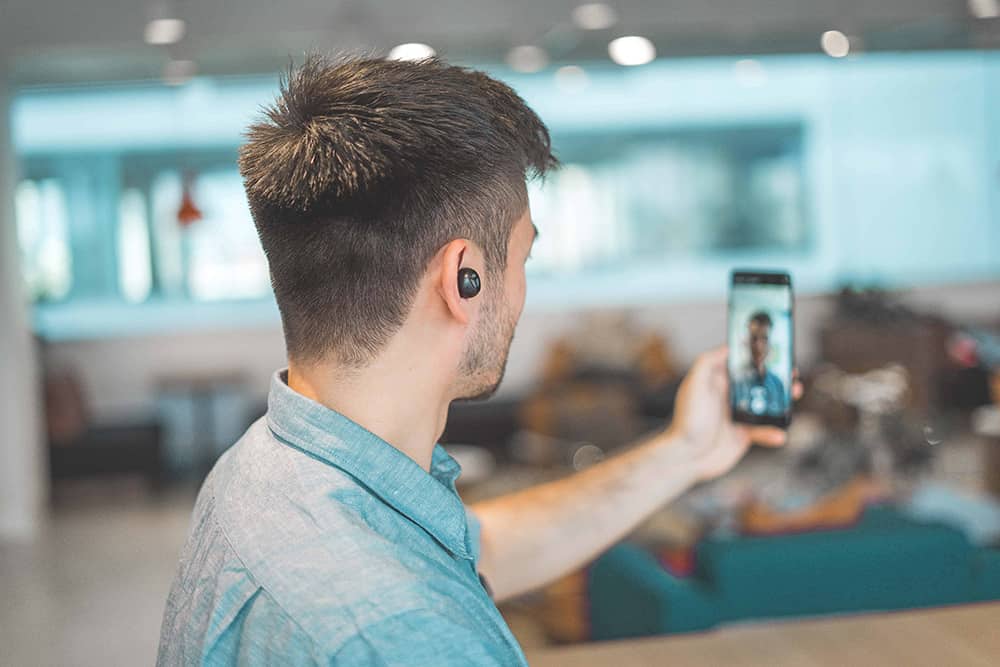 business person recording smartphone video marketing