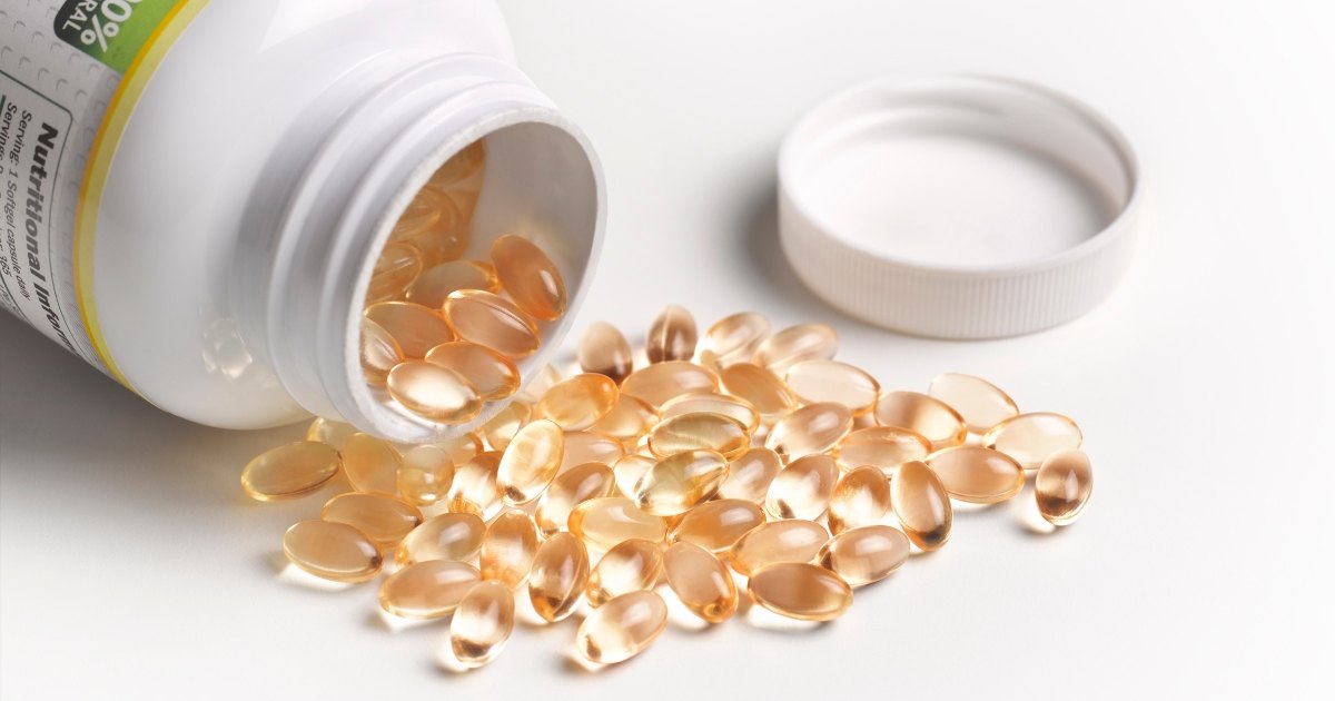 vitamin d capsules on table