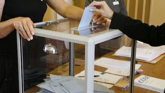 political debate table, economic redistribution, voting booth and polling station