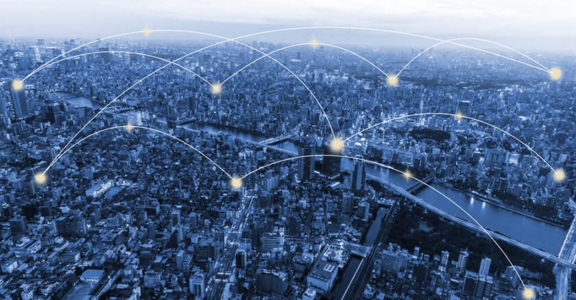 aerial view of cityscape with digital network lines