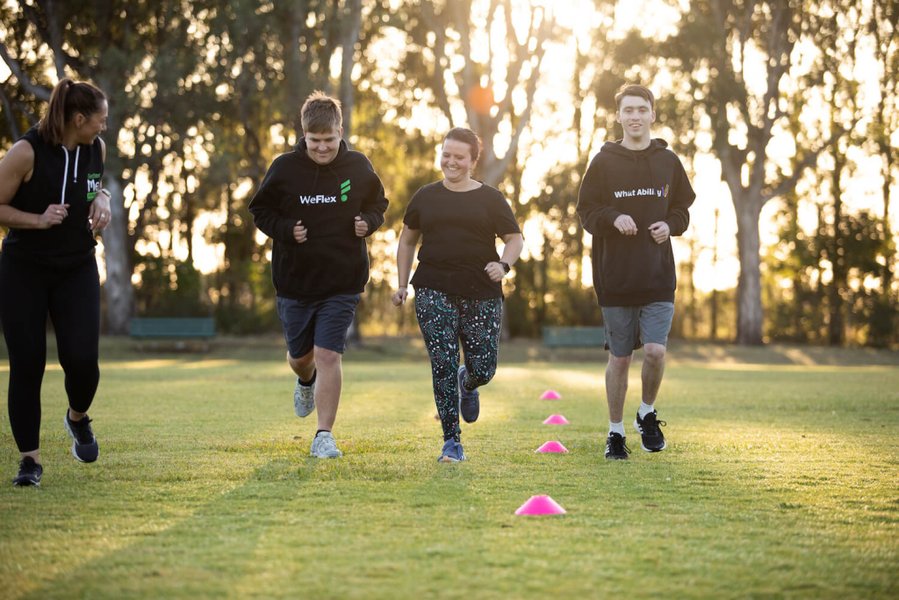 A group fitness session, highlighting the type of services NDIS might fund.