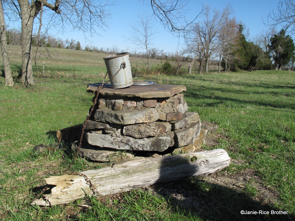 old well in rural landscape