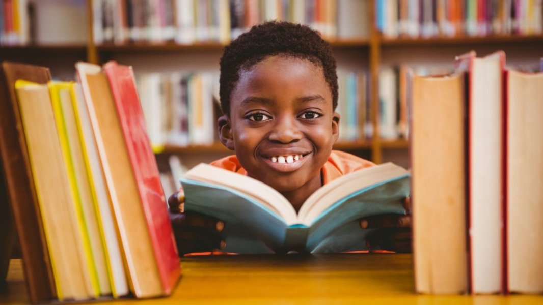 Child looking at illustrations in a book