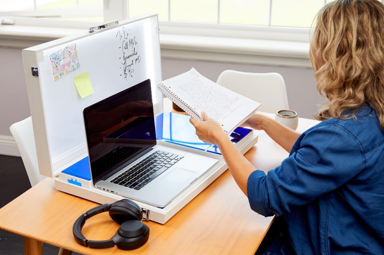 office desk with laptop and documents