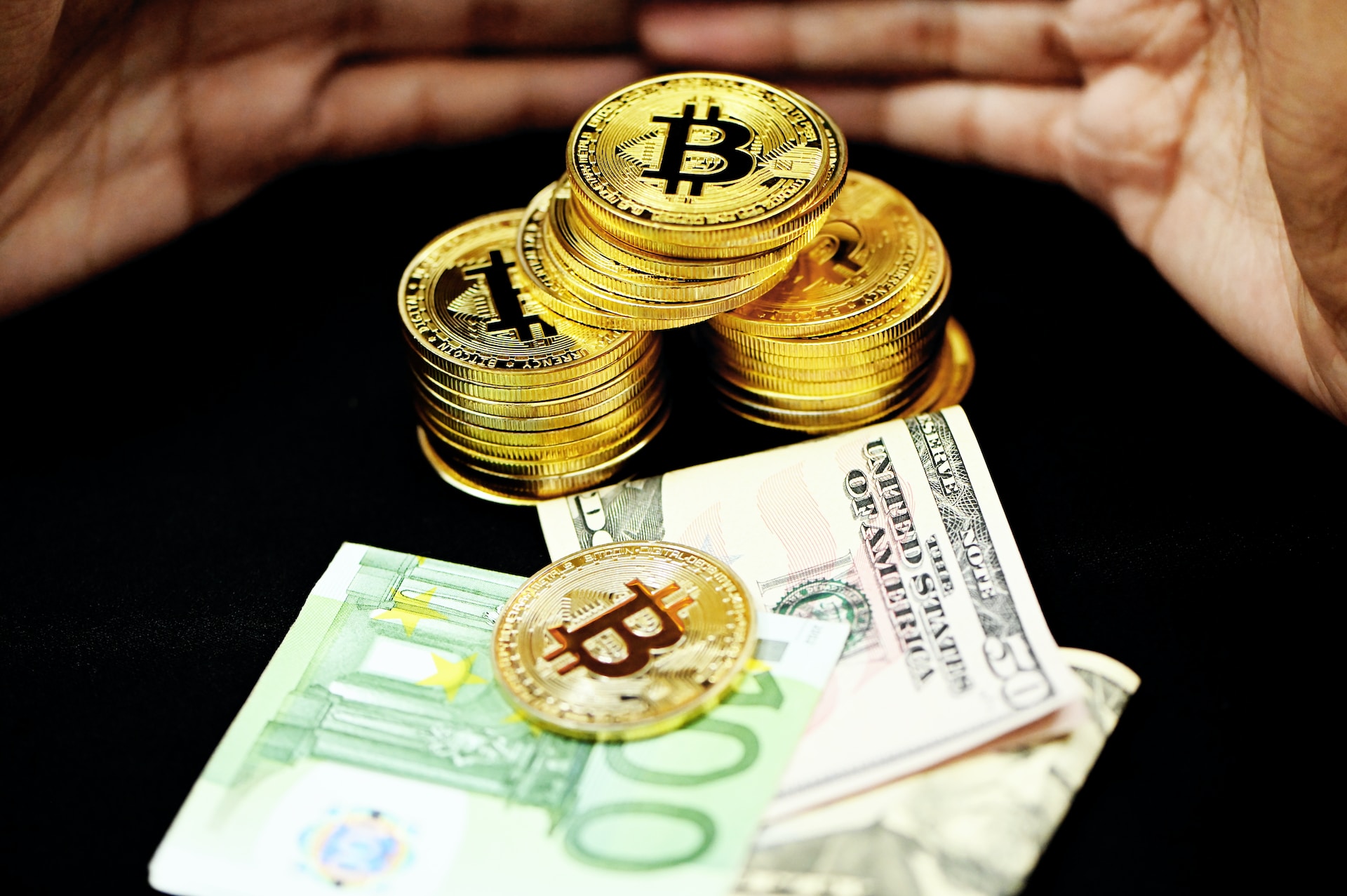 financial charts and digital currency pile