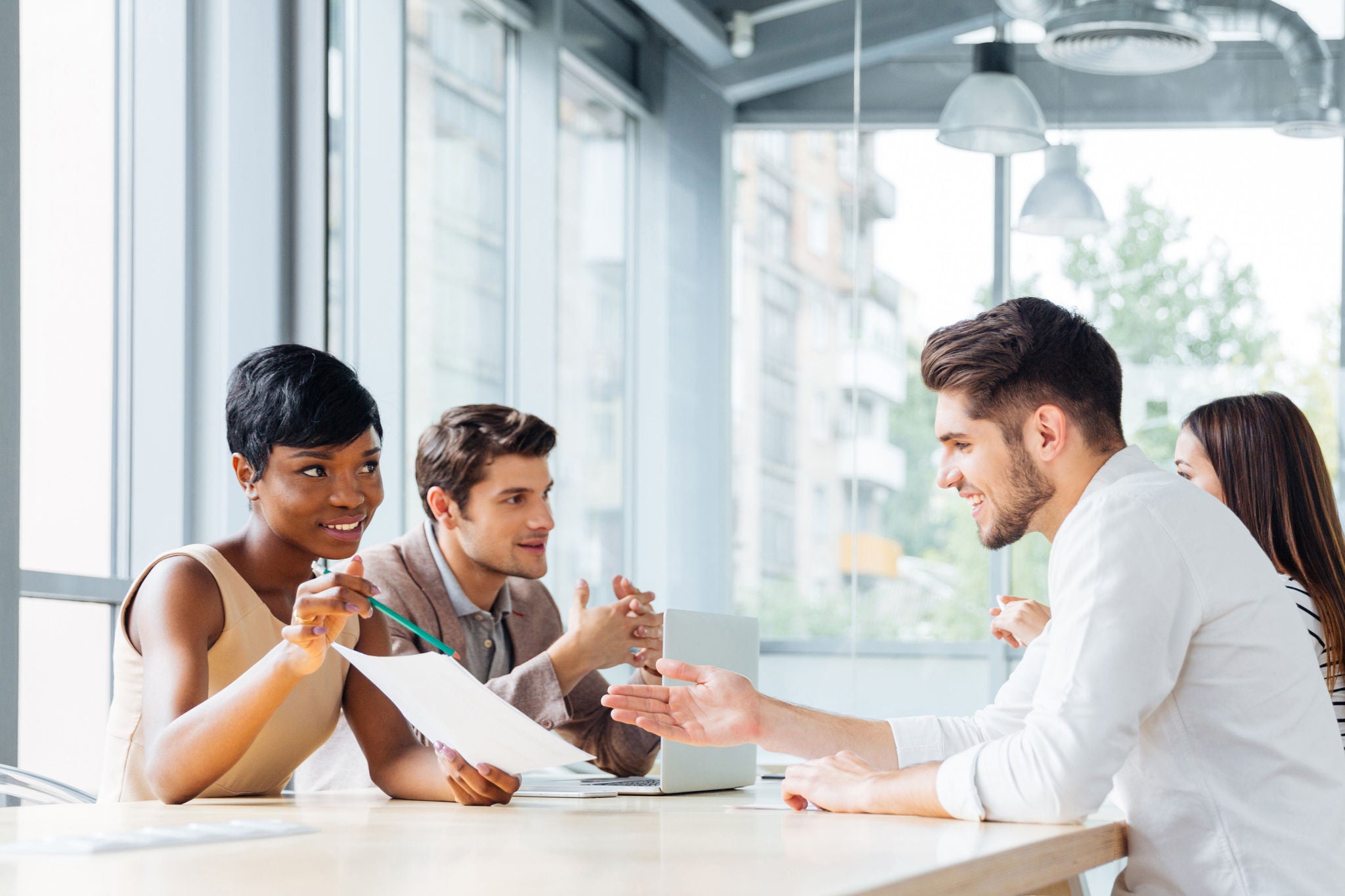 young professionals discussing project plans in a modern office
