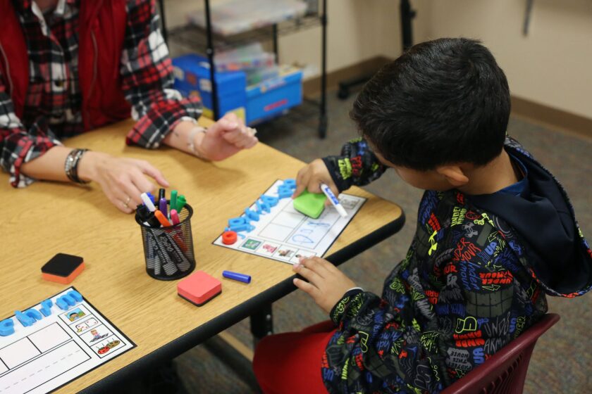 youngest sibling studying and working in a busy urban setting