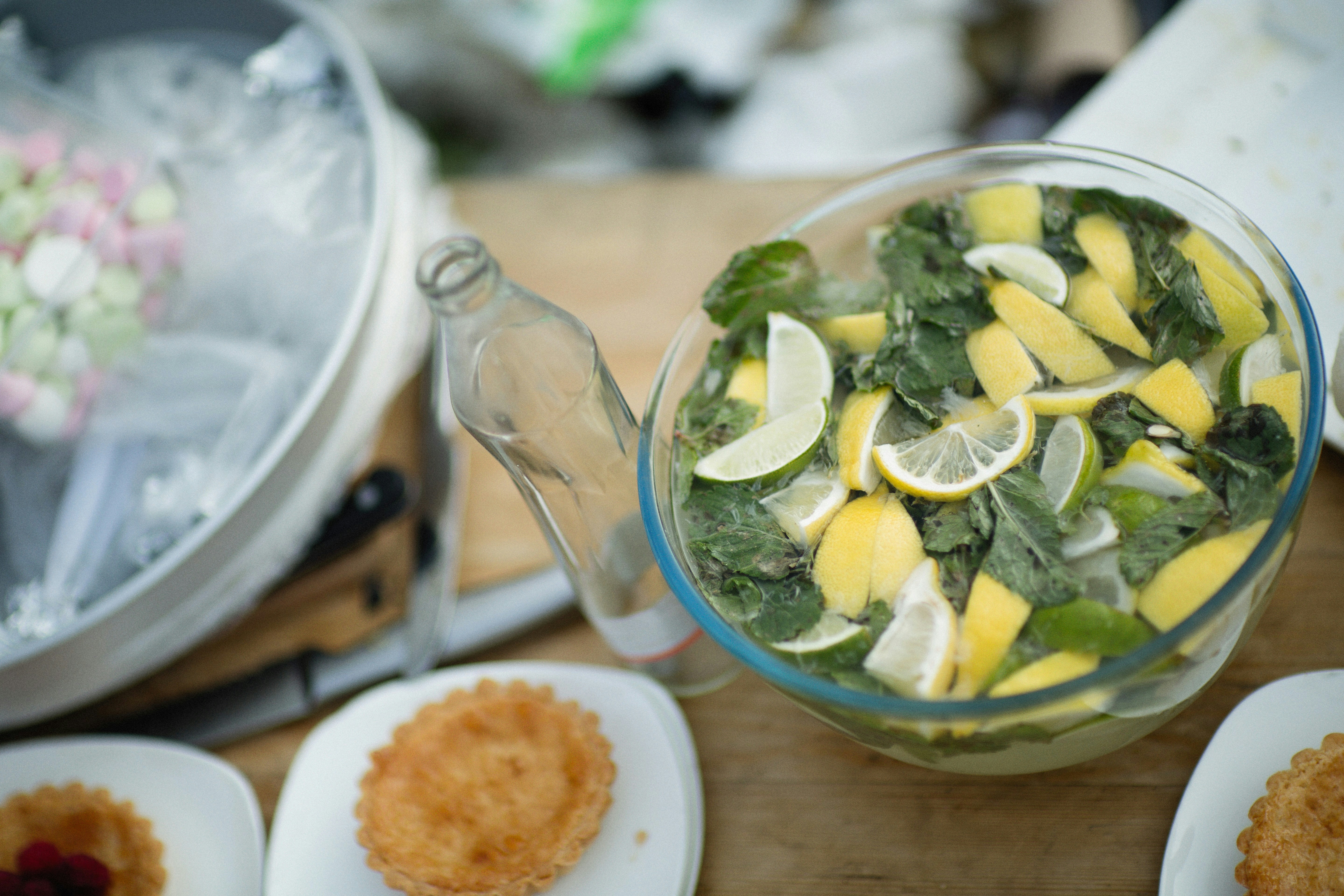 a salad with lemons and spinach in a bowl